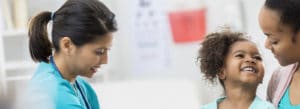 Medical professional with a mother and her young daughter